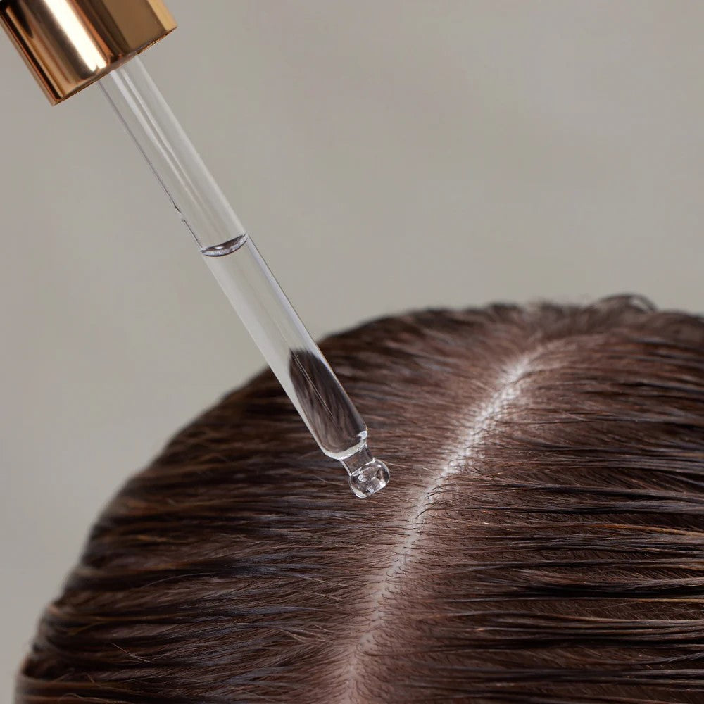 Hair Renew Daily Active Serum – clear dropper with rose gold cap, transparent serum on brown hair, neutral background – hair care