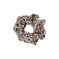 Beige leopard print scrunchie on a white background.