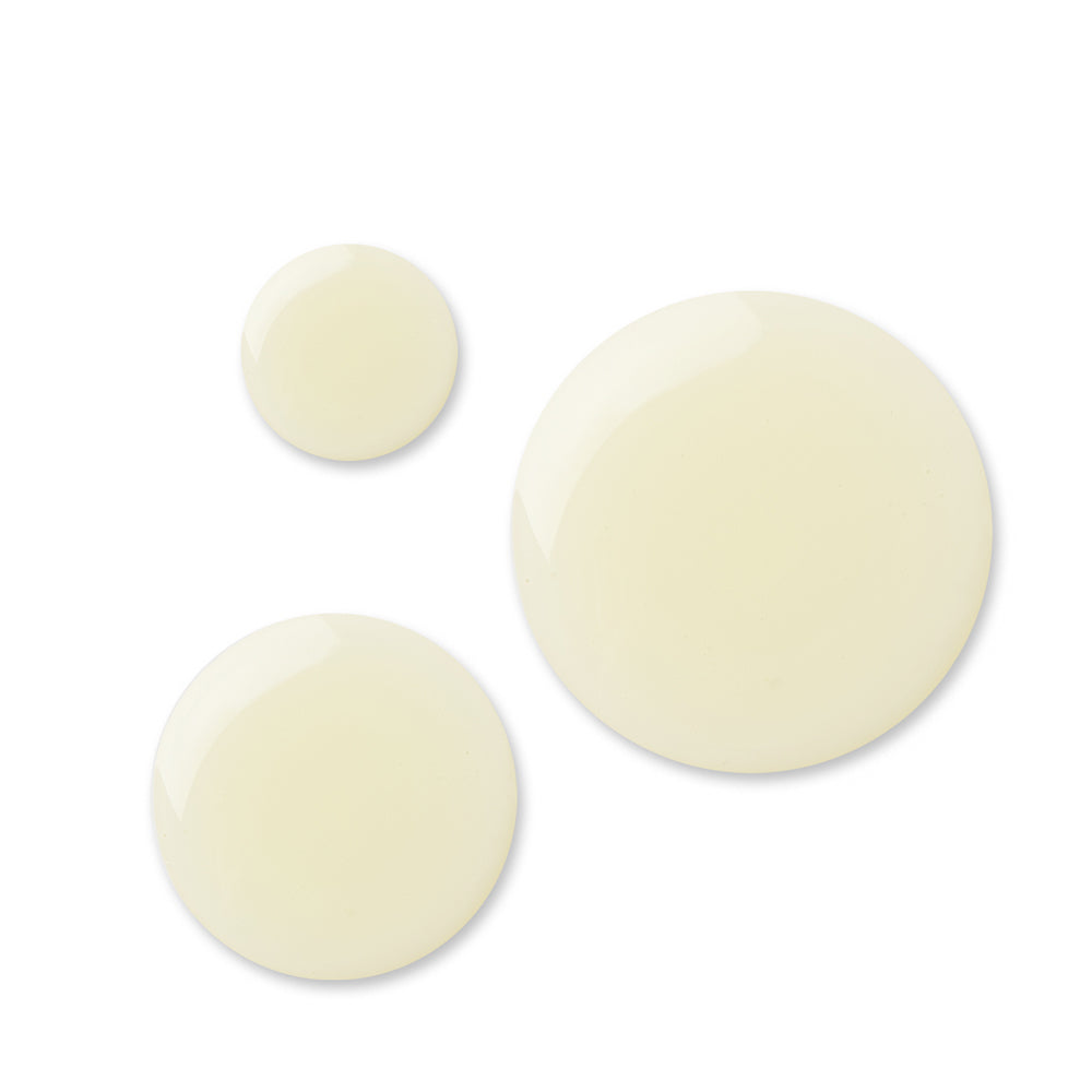 Drops of Rosehip Miracle Facial Oil in pale yellow on a white background, skin care