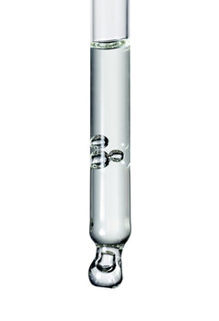 Botanical Serum Chanua – clear glass dropper tube with drops, white background – serum