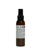 L:A BRUKET No. 290 Firming Body Serum – amber glass bottle with spray nozzle, white label, black cap – body care