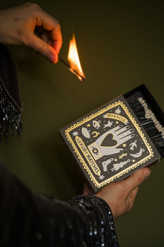 Black Miracle Luxury Matches – black box with gold detailing, dark background – lifestyle