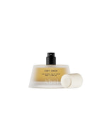 Bottle of 'Coat Check' perfume by Abel with a white cap on a white background.