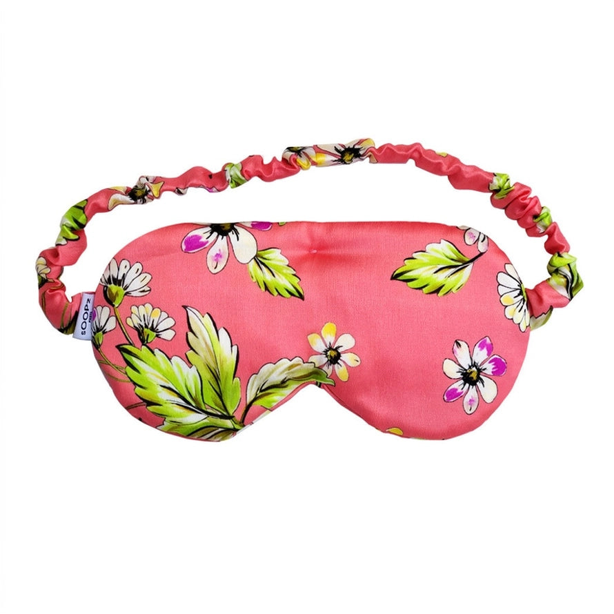 Le Flora Schlafmaske in Pink mit Blumenmuster und Gummiband.
