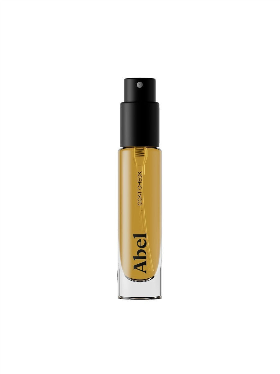 Abel Coat Check Eau de Parfum – clear glass bottle with black spray nozzle, white background – perfume