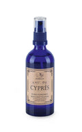 Apomanum Eau de Cyprès – blue spray bottle with clear atomizer, beige label, white background – room fragrance