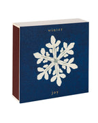 Winter Joy gift box – dark blue packaging with white snowflake design, gold text, white background – skin care