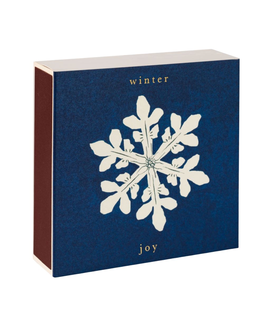Winter Joy Geschenkbox – dunkelblaue Verpackung mit weißem Schneeflocken-Design, goldener Schrift, weißem Hintergrund – Hautpflege
