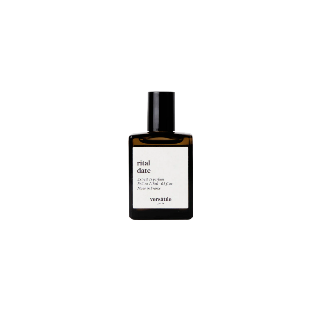 Rital Date Roll-on perfume oil in a brown glass bottle with a black cap on white background, 15ml fragrance oil