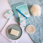 KLAR Sea Salt Soap – cream-colored bar on gray dish, blue and white packaging, light blue background – skin care