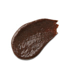 Texture of Radiant Glow 2-in-1 Mask Scrub, brown scrub swatch on white background, skin care
