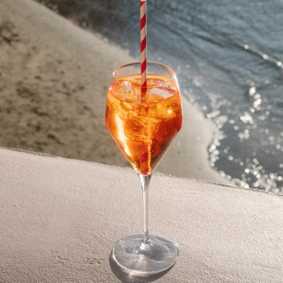 Lifestyle image featuring an orange drink in a glass, complementing the Rital Date Roll-on Parfümöl fragrance profile.