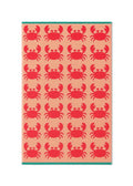 Crabs Organic Cotton Beach Towel with red crabs on peach background, teal border – beach accessory