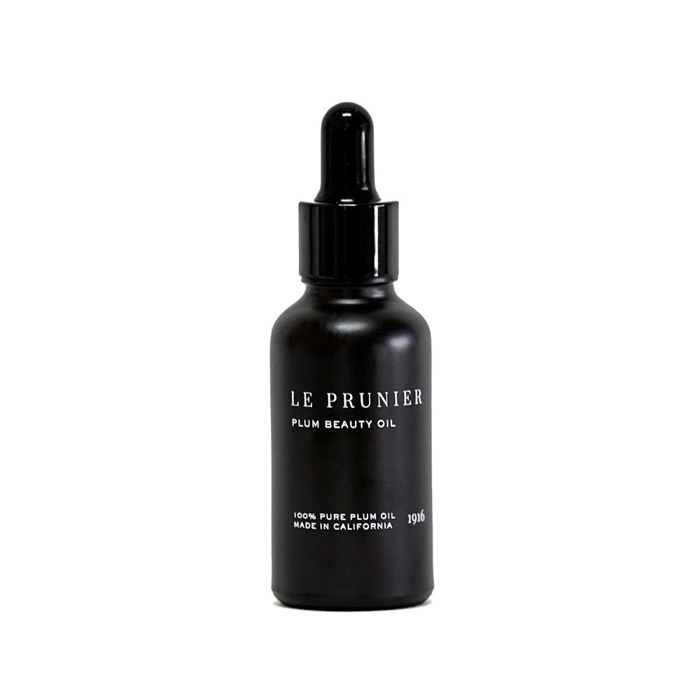 Le Prunier Pflaumen Beauty Oil – schwarze Glasflasche mit Tropfverschluss, weißer Hintergrund – Hautpflege