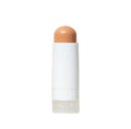A white stick with skin-toned concealer or foundation on a white background.