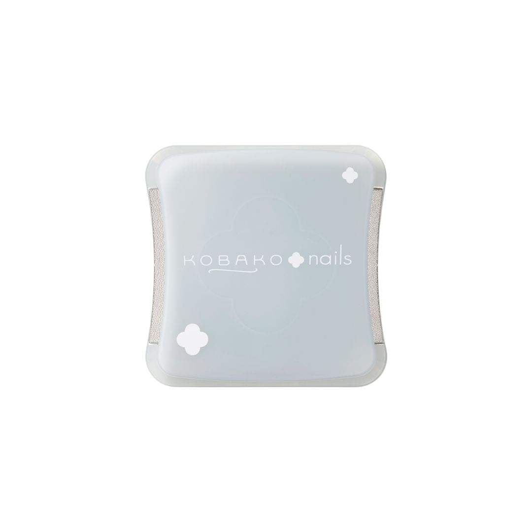 Kobako Nails Compact Nail File – light blue rectangle with white clovers, white background – nail care