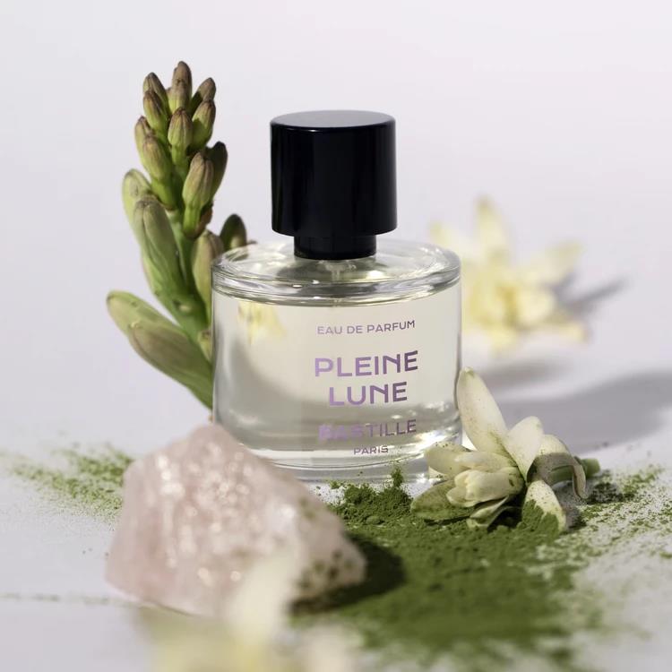 Pleine Lune Eau de Parfum – clear glass bottle with black cap, white background – perfume