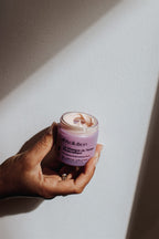 Absolution Le Masque du Temps Redensifiant in a purple glass jar on a white background, skin care