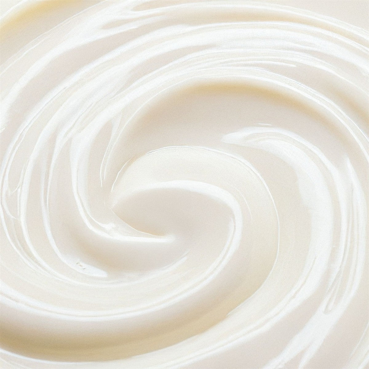 Close-up of the creamy texture of Brightening Plus Serum for skin care