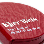 Kjaer Weis Eye Shadow – red textured packaging, white lettering, white background – makeup