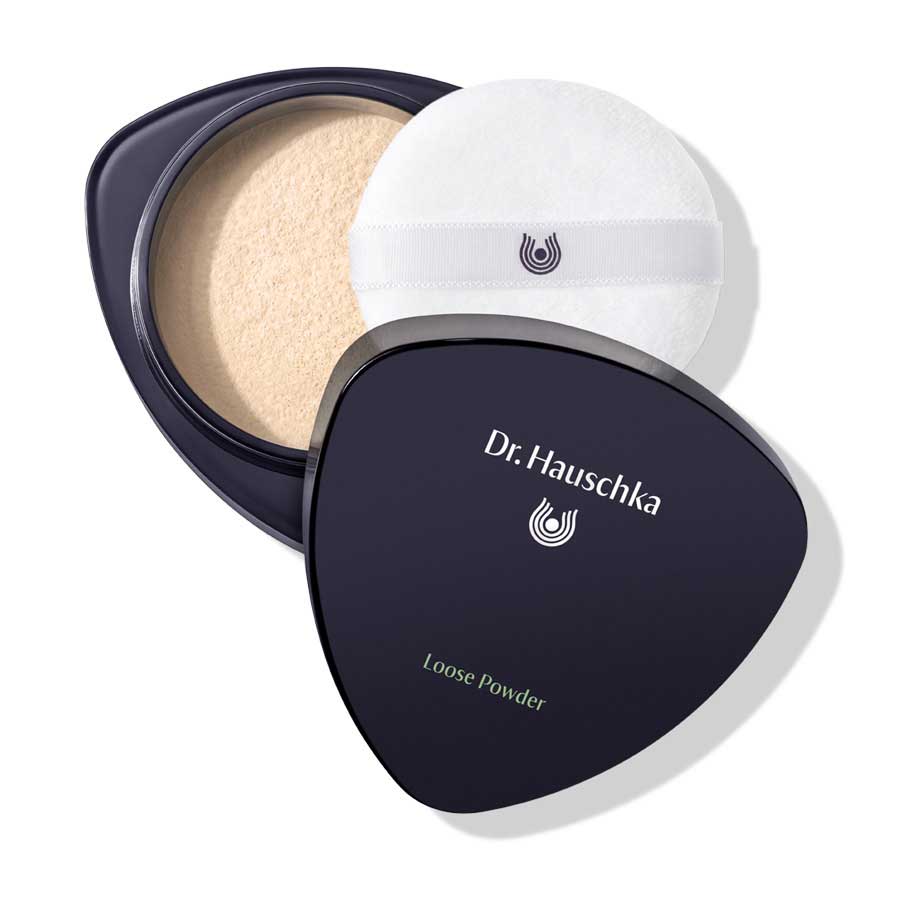 Dr. Hauschka Loose Powder 00 Translucent – black compact, white puff, white background – makeup
