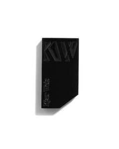 Kjaer Weis Lip Balm – black metal case, white background – lip care