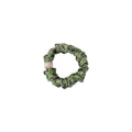 Green paisley print scrunchie on a white background.