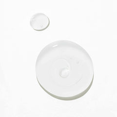 Clarity Hairbath – clear liquid droplets on white background – hair care