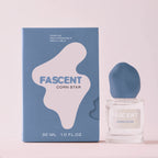 Fascent Corn Star Eau de Parfum – klares Glasfläschchen 30ml, blauer Deckel, blaue Verpackung, rosafarbener Hintergrund – Parfüm