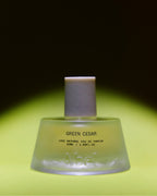 Abel Green Cedar Eau de Parfum – green glass bottle 50ml, matte white cap, bright green background – perfume