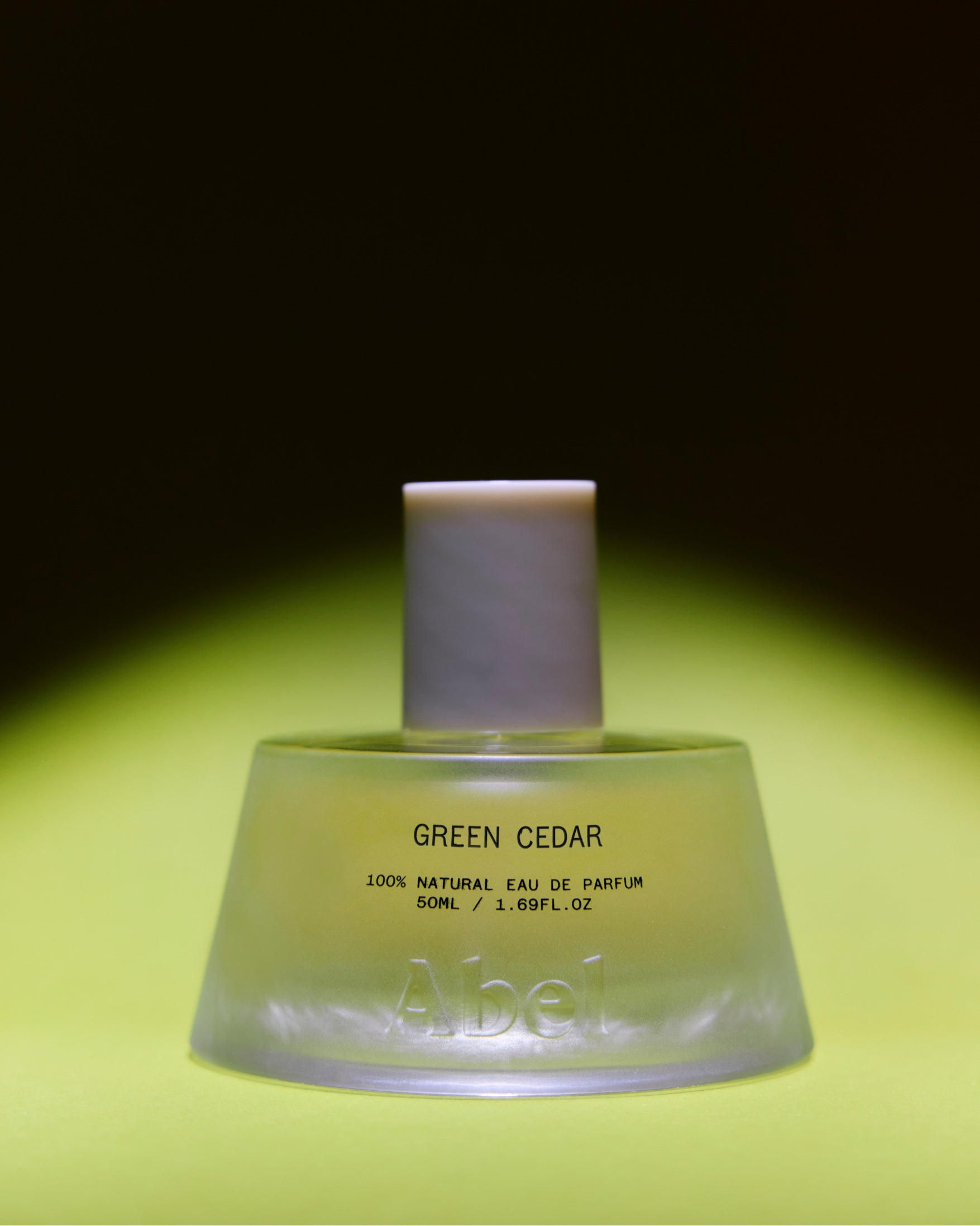 Abel Green Cedar Eau de Parfum – green glass bottle 50ml, matte white cap, bright green background – perfume