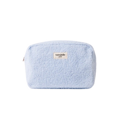 Light blue Beauty Pouch makeup bag by versatile paris made of fluffy material against a white background.