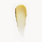 Black Collection Lip Balm – creamy texture on white background, golden shimmer – lip care