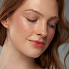 ReDimension Daily Glow Palette effect on a woman's face, glowing complexion, makeup