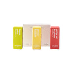 Versátile Paris Discovery Box with three colorful perfume sample bottles in yellow and red boxes on a white background.