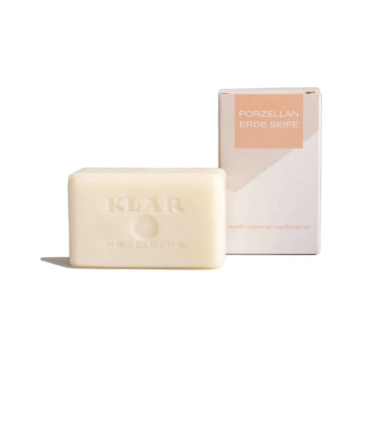 KLAR Porcelain Clay Soap – cream-colored bar with embossing, beige box, white background – skin care