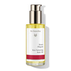 Dr. Hauschka Rose Nurturing Body Oil – clear glass bottle with pump, white-red label, white background – body care