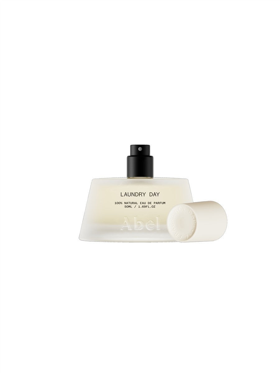 Abel Laundry Day Eau de Parfum – 50ml spray bottle, cream glass, black atomizer, white background – perfume