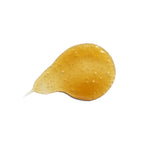 Gold-yellow gel texture of Rose Facial Cleansing Gel on a white background, skin care.