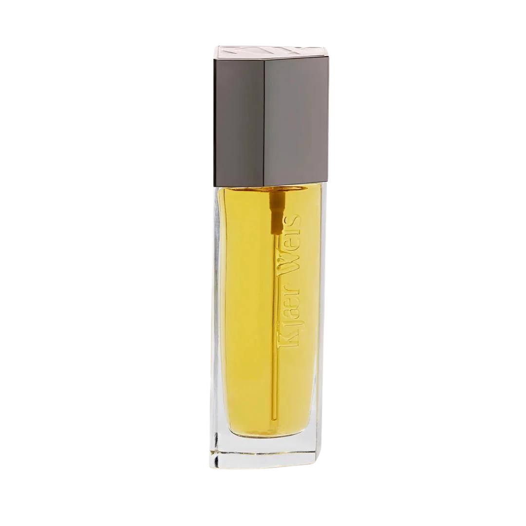 Kjaer Weis Body Oil – clear glass bottle with golden-yellow oil, dark square cap, white background – body care
