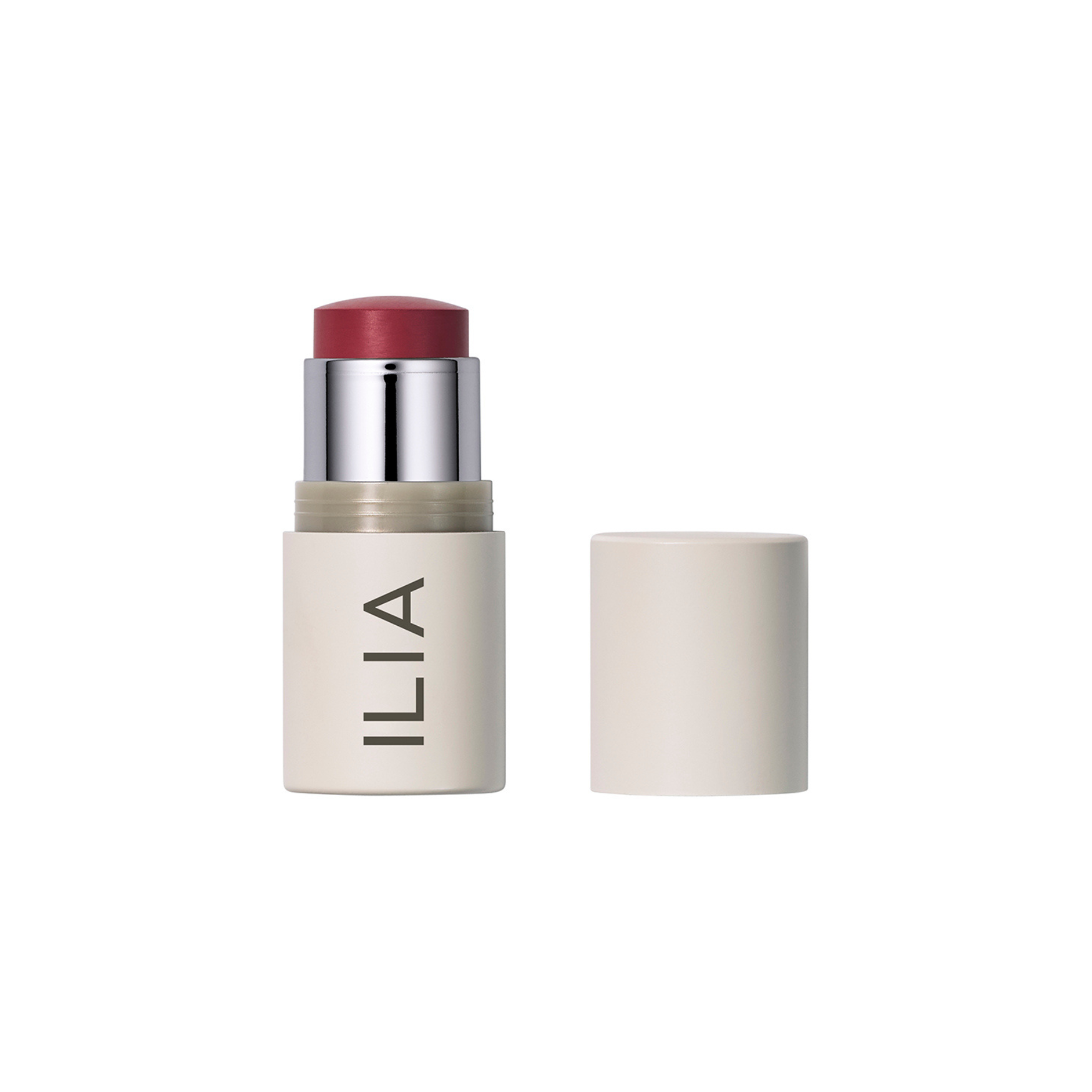ILIA Multi-Stick in beiger Tube mit silbernem Rand und rotem Stick auf weißem Hintergrund, Make-up.
