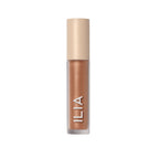ILIA Liquid Powder Chromatic Eye Tint in Gold in einer Glasflasche mit Verschluss auf weißem Hintergrund, Augen-Make-up