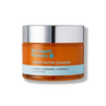 The Organic Pharmacy Carrot Butter Cleanser in an jar with a silver lid on white background, skin care