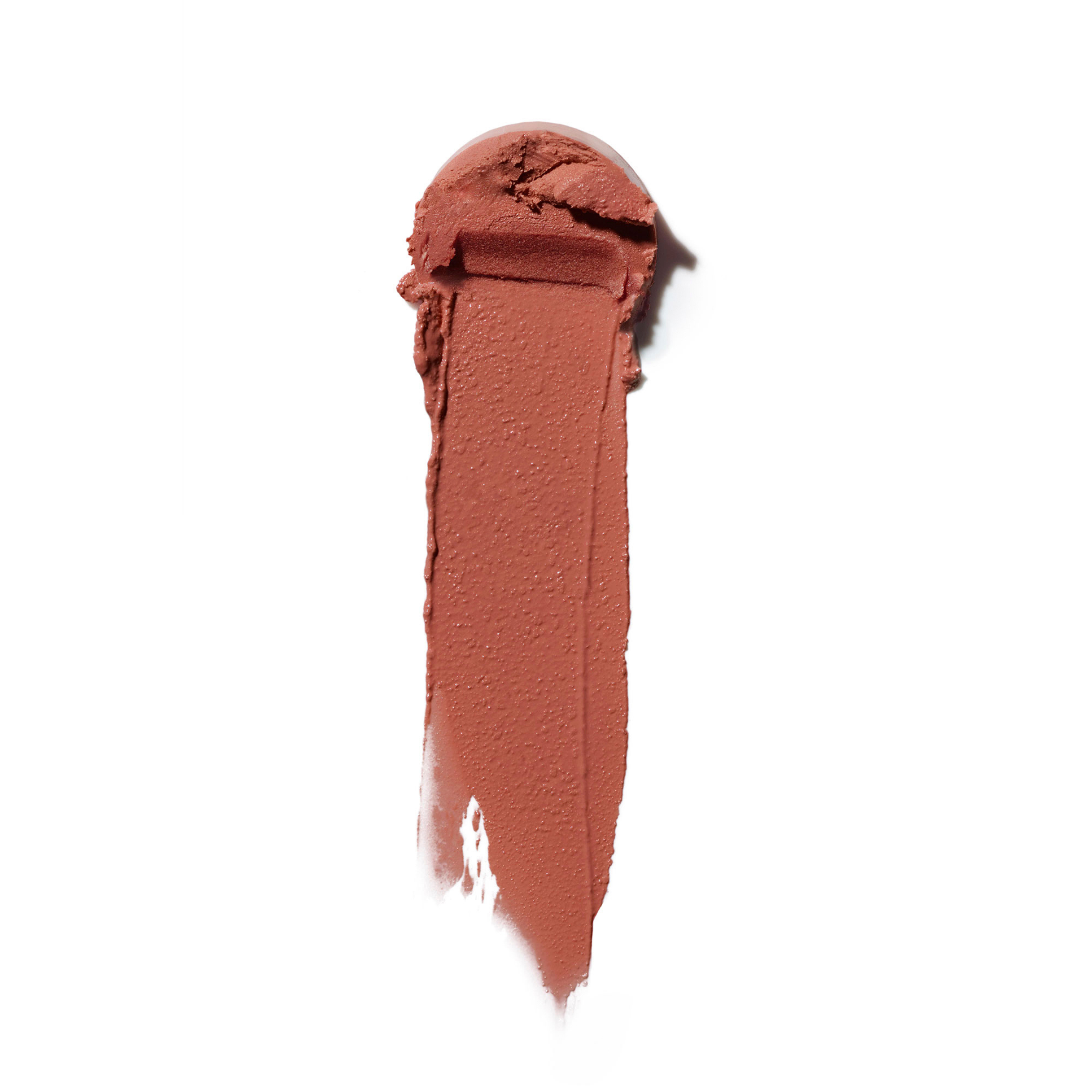 Ein cremiger Strich des Multi-Sticks in Terrakotta auf weißem Hintergrund für ein natürliches Make-up.