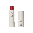 ILIA Balmy Tint Hydrating Lip Balm in a white tube with red lipstick on a white background, lip care