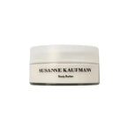 Susanne Kaufman Body Butter in a jar with a white lid on a white background, skin care.