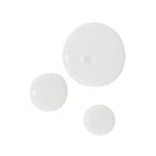 Latschenkiefer Oil Bath: Three drops of whitish oil on a white background, body care.