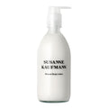 bottle with pump of Susanne Kaufmann Mineral Body Lotion against a white background, skin care.
