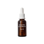Susanne Kaufmann Face Oil in a glass bottle with a white dropper cap on a white background, skin care
