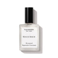 Rescue Serum in a clear bottle with a black cap on a white background, nail care.